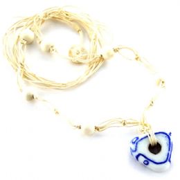 Long knitted necklace with white and blue glass bead